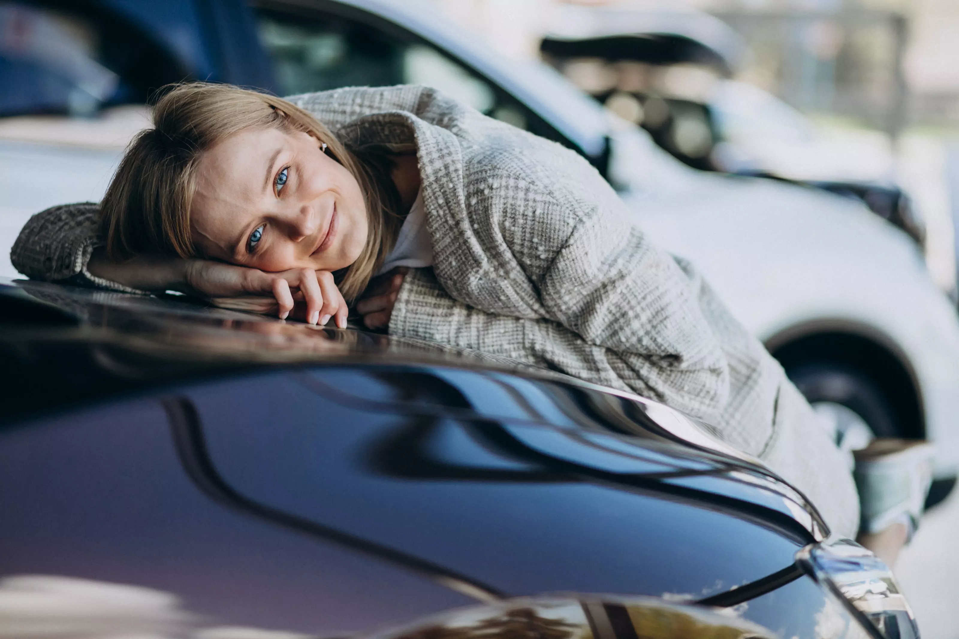 young-woman-choosing-car-car-showroom