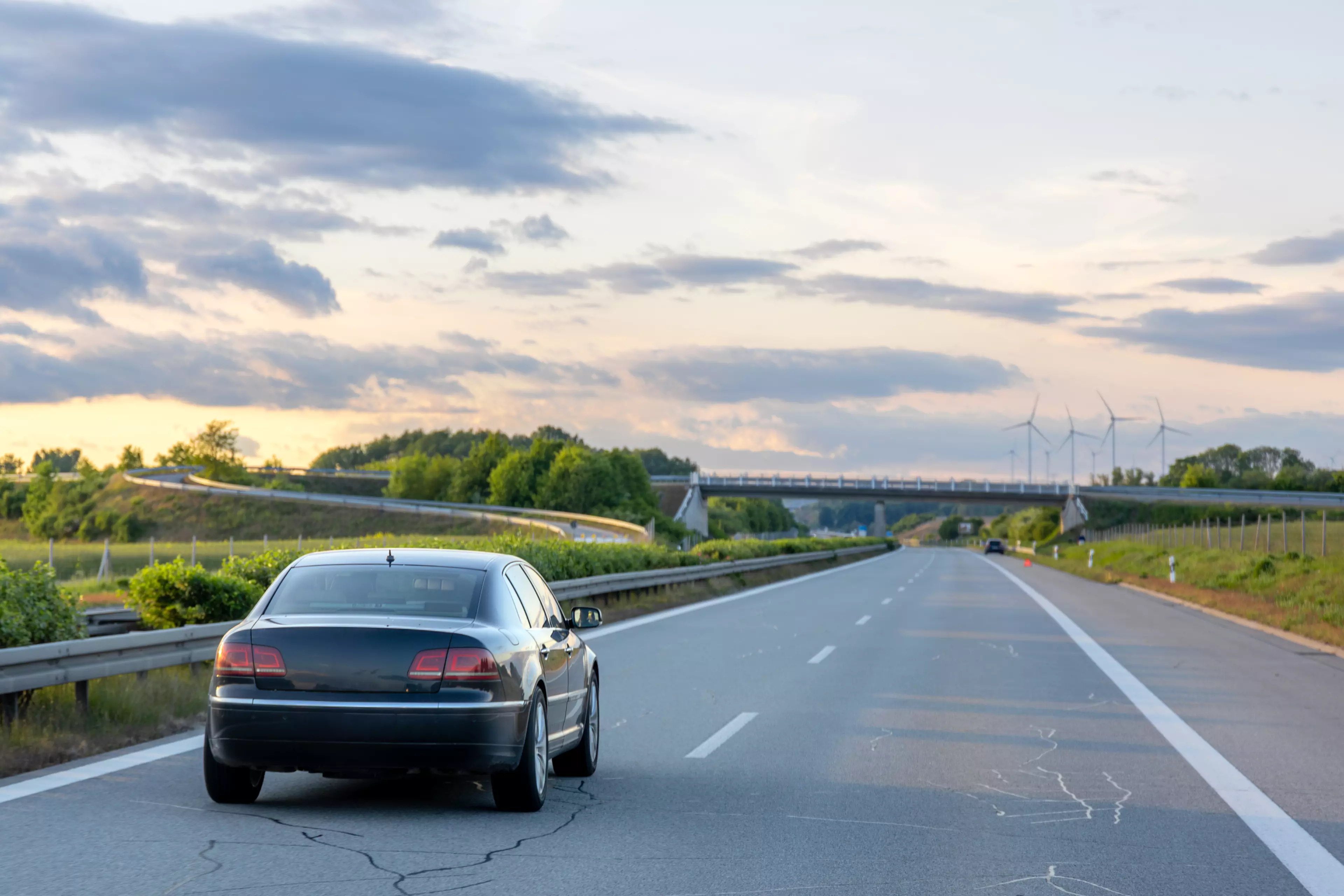 car-highway-road-through-greenery-evening-drive